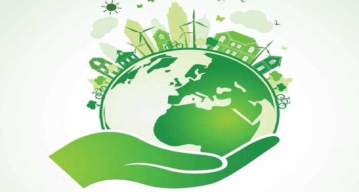 Hands Holding The Green Earth Globe with city